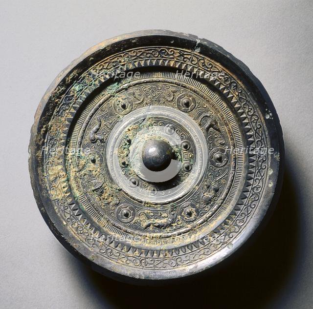Mirror with Concentric Circles, an Immortal, and Auspicious Animals, 1st century. Creator: Unknown.
