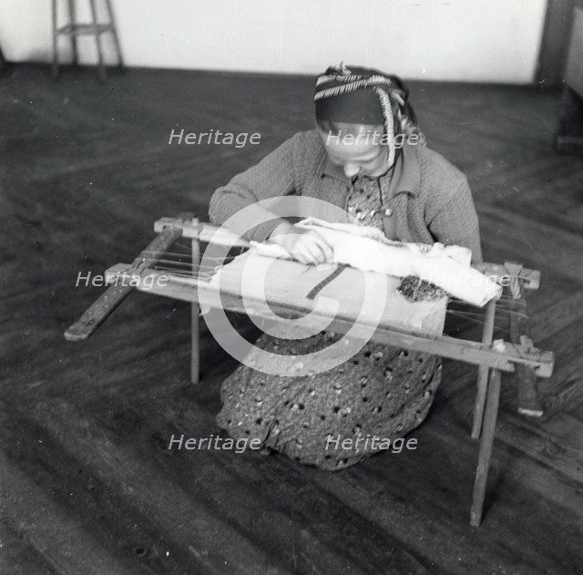 Woman weaving, Sarajevo, Bosnia-Hercegovina, Yugoslavia, 1939. Artist: Unknown