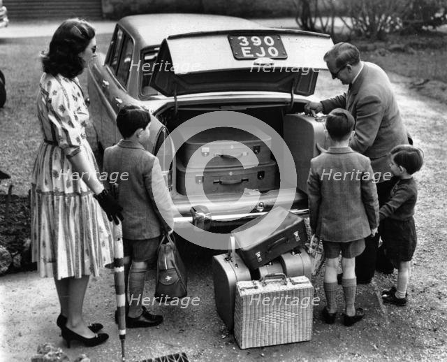 1959 Morris Oxford Series V with family and luggage (courtesy B.M.I.H.T). Creator: Unknown.