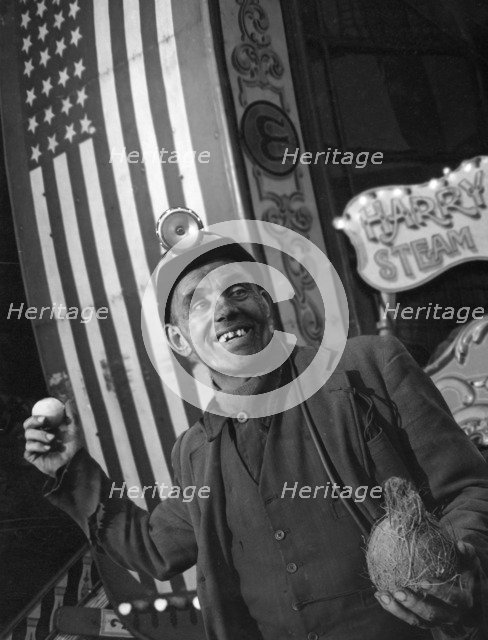 Miner at a fairground, Conisbrough, near Doncaster, South Yorkshire, 1955. Artist: Michael Walters