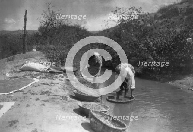 Washing wheat-San Juan, c1905. Creator: Edward Sheriff Curtis.