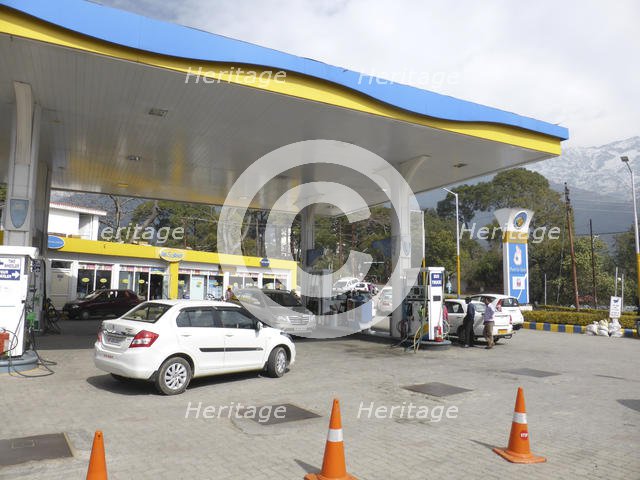 Cars re-fuelling at petrol station Dharamshala Himachal Pradesh. Creator: Unknown.
