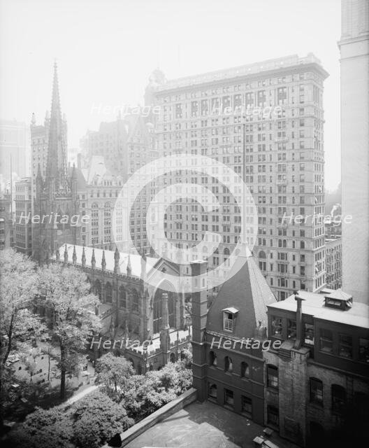 New York, N.Y., Trinity churchyard and the skyscrapers, between 1900 and 1920. Creator: Unknown.