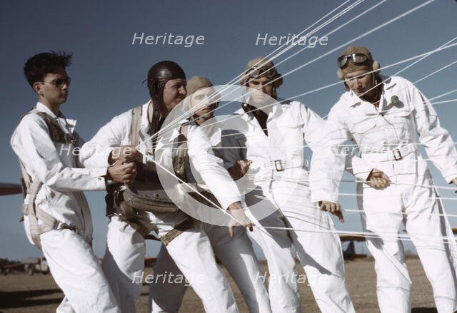 Instructor explaining the operation of a parachute to student pilots, Fort Worth, Tex., 1942. Creator: Arthur Rothstein.
