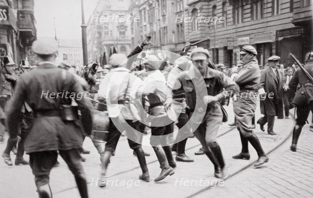 Men in Bolshevik uniform fighting police in the street, Germany, c1918-c1933(?) (1936). Artist: Unknown