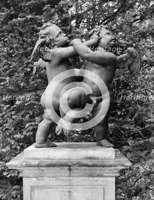'Cherubs - the Quarrel', statue in the gardens of Melbourne Hall, Derbyshire, 1954. Artist: GB Mason.