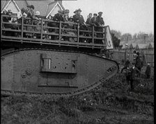 People Riding a Tank Over Rough Terrain, 1920. Creator: British Pathe Ltd.