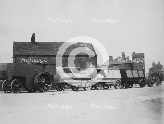 1900 Fowler F5 armoured traction engine with munitions wagons. Creator: Unknown.