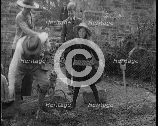 British Chancellor of the Exchequer Joseph Austen Chamberlain Working in the Garden With His...,1920 Creator: British Pathe Ltd.