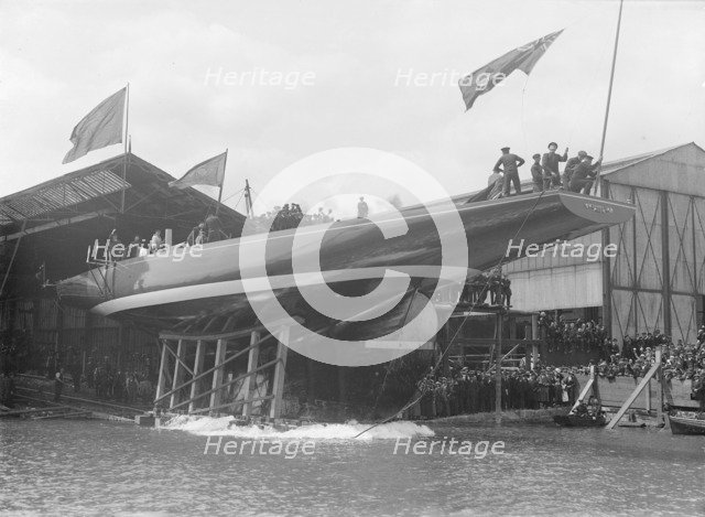 The launch of 'Shamrock IV' at Gosport, May 1914. Creator: Kirk & Sons of Cowes.