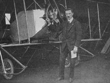 One of the best instructors: Lewis WF Turner standing by a Caudron training biplane, 1913 (1934). Artist: Flight Photo.