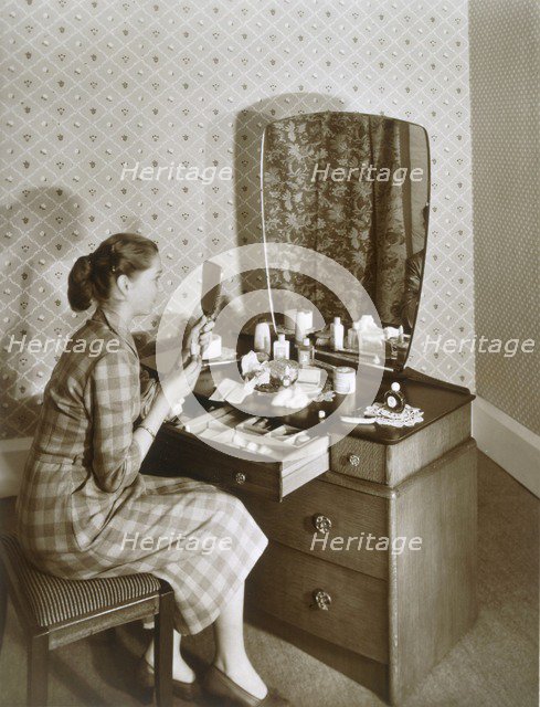 Woman at her dressing table, c1955. Creator: English Photographer (20th Century).