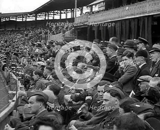 British Crowds Watching a Cricket Match, 1943-1944. Creator: British Pathe Ltd.