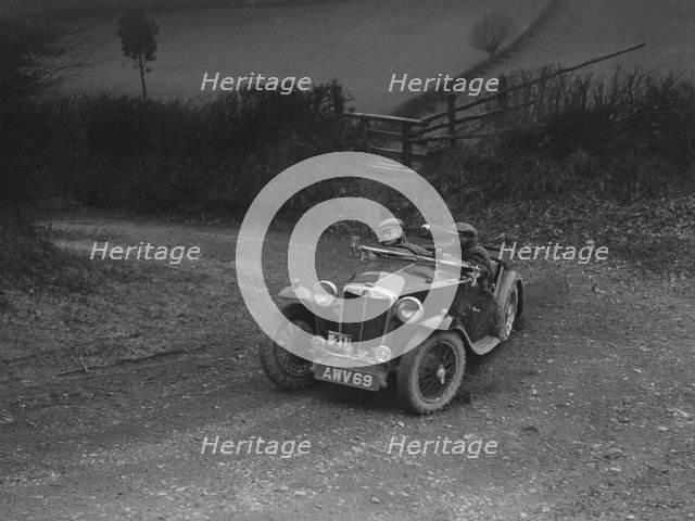 MG TA of HV Slade competing in the MG Car Club Midland Centre Trial, 1938. Artist: Bill Brunell.