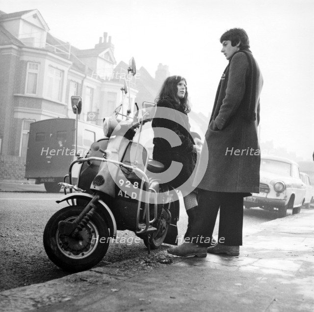 Couple with a scooter, London, 1967. Artist: Henry Grant
