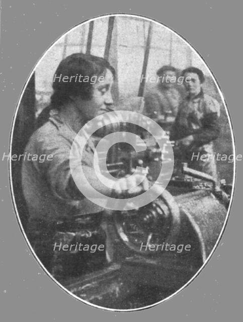 'Les femmes dans les usines de guerre; Une jeune Parisienne travaillant a l'evidement..., 1916. Creator: Unknown.
