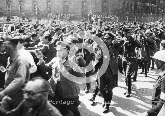German officers surrendering, Rue de Rivoli, Paris, August 1944. Artist: Pierre Mandé