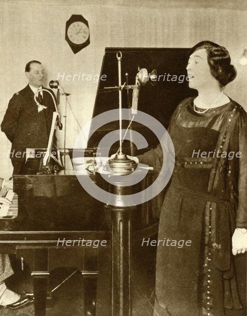 Performers singing a duet in one of the studios of 2LO, Savoy Hill, London, 1923, (1935). Creator: Unknown.