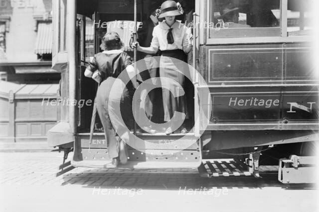 Getting on Brdway car, between c1910 and c1915. Creator: Bain News Service.