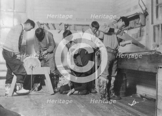 Eskimos doing carpenter work, between c1900 and c1930. Creator: Unknown.