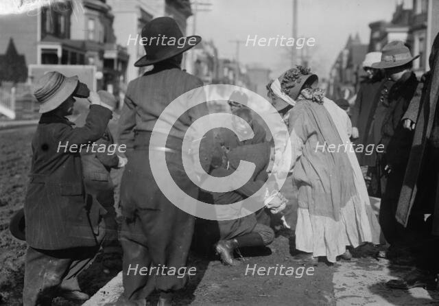Scramble for pennies, Thanksgiving, between c1910 and c1915. Creator: Bain News Service.