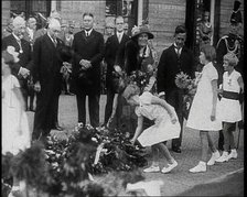 Young Girls Leaving Flowers in a Pile for Wilhelmina, Her Majesty the Queen of the Netherlands,1930s Creator: British Pathe Ltd.