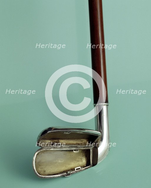 Silver cigarette case walking stick designed to look like a golf club, c1910. Artist: Unknown