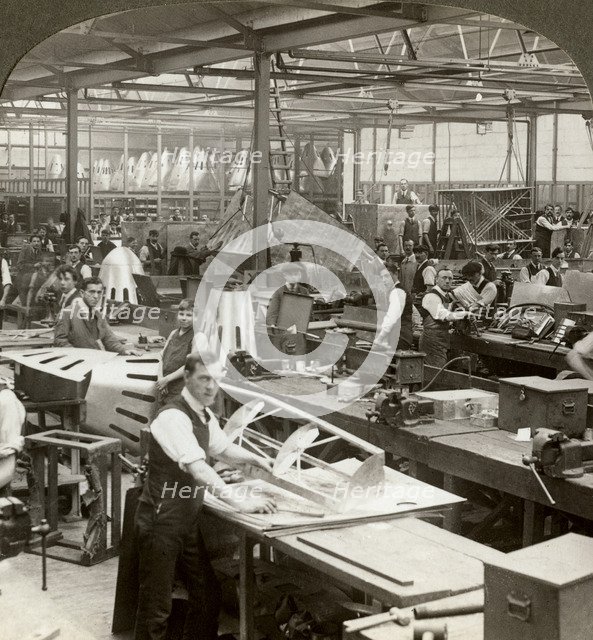 Sheet metal workers at a aeroplane factory, World War I, 1914-1918. Artist: Realistic Travels Publishers