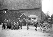 Postmen and other staff pose outside the post office in Byfield, Northamptonshire, c1873-c1923. Artist: Alfred Newton & Sons