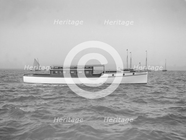 The motor launch 'Cygnet' under way, 1912. Creator: Kirk & Sons of Cowes.