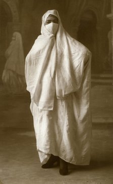 Veiled woman, Algiers, Algeria, 1943. Artist: Unknown