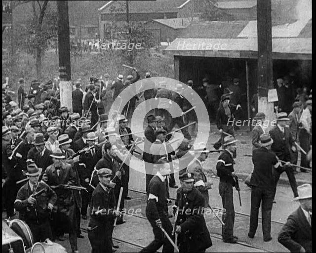 Small Crowd of American Civilians on a Demonstration/Strike in Conflict with the Police, 1930. Creator: British Pathe Ltd.