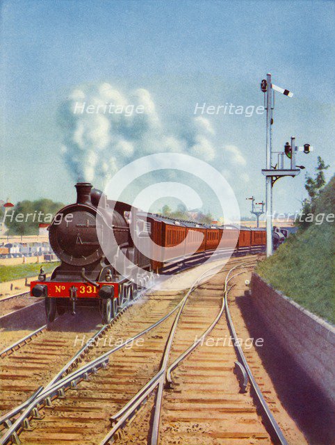 'Leaving Dublin. Great Southern Railways train, hauled by a 4-4-0 passenger express', 1935. Creator: Unknown.