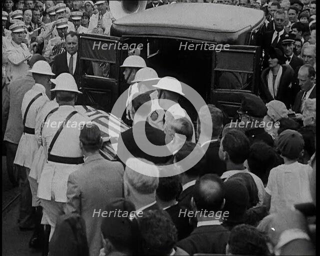 Male American Soldiers in White Uniforms Taking the Coffin of Anton Cermak, the Mayor of..., 1933. Creator: British Pathe Ltd.
