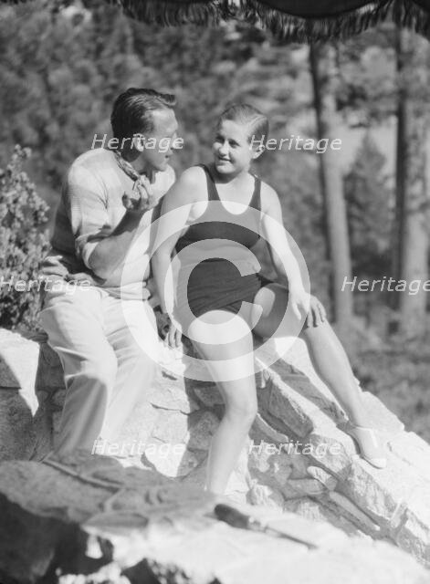 Lee, Margaret, Miss, and unidentified man, seated outdoors, 1927 Creator: Arnold Genthe.