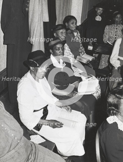 Members of the congregation of the "store front" Baptist Church, Chicago, Illinois, April, 1941. Creators: Farm Security Administration, Russell Lee.