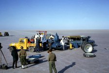 Mechanics fuelling Bluebird CN7 for World Land Speed Record attempt, Lake Eyre, 1964. Creator: Unknown.