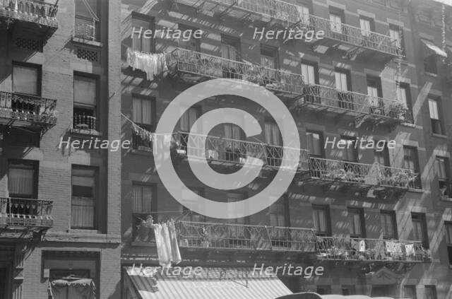 House fronts, 61st Street between 1st and 3rd Avenues, New York, 1938. Creator: Walker Evans.