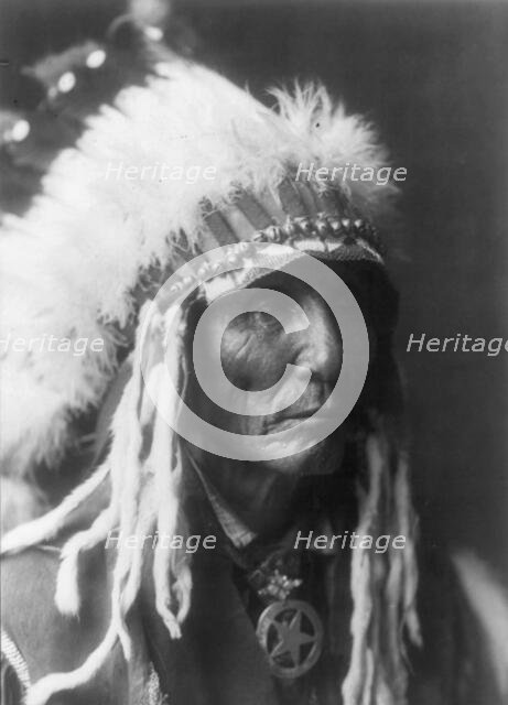 Calico - Oglala, head-and-shoulders portrait, facing right, between 1890 and 1910 Creator: Edward Sheriff Curtis.