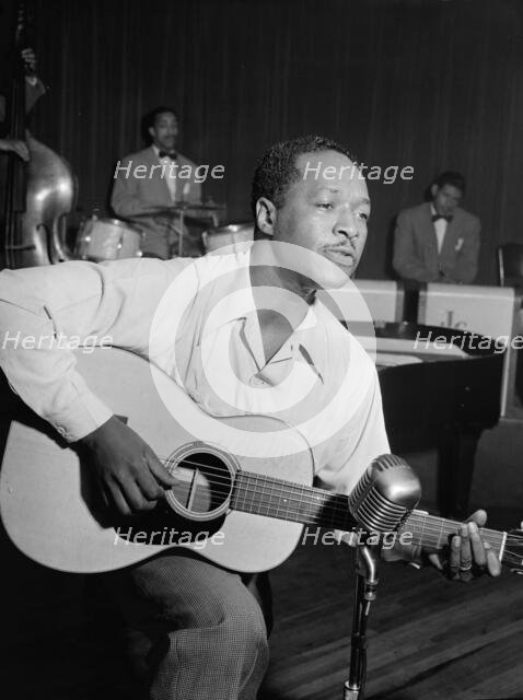 Portrait of Josh White, Café Society (Downtown), New York, N.Y., ca. June 1946. Creator: William Paul Gottlieb.