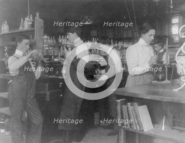 Students in a chemistry class conducting an experiment, Western High School, Washington DC, (1899?). Creator: Frances Benjamin Johnston.