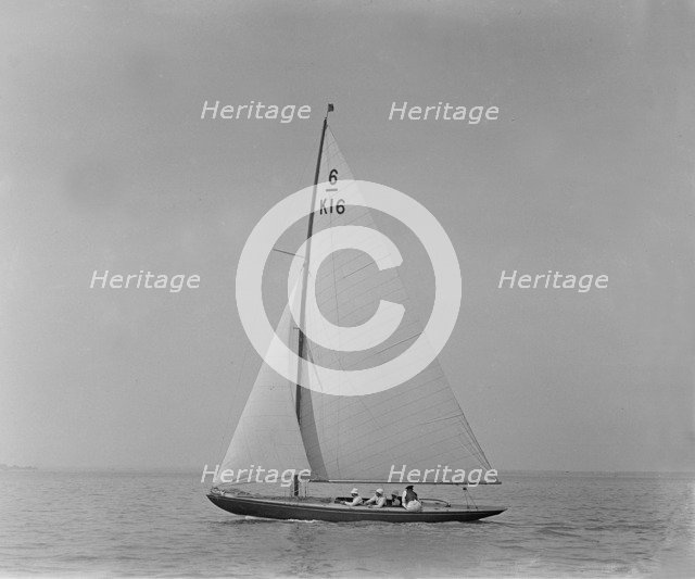 The 6 Metre class boat 'Jean' (K16) sailing close-hauled, 1921. Creator: Kirk & Sons of Cowes.