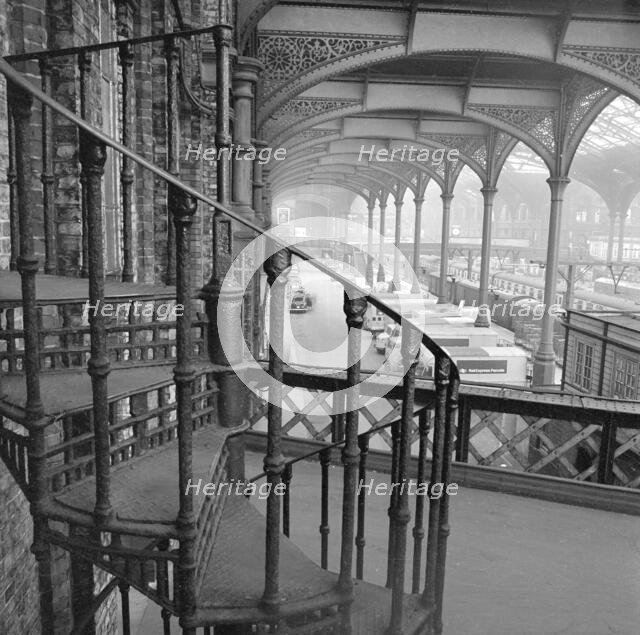 Interior of Liverpool Street Station showing a cast iron spiral staircase, 1960-1972.   Creator: John Gay.