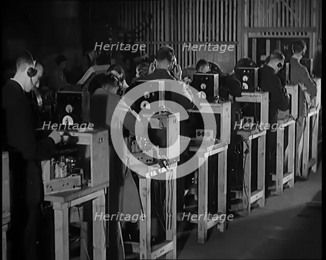 Male Civilians Building Radio Wireless Sets in a Factory, 1931. Creator: British Pathe Ltd.