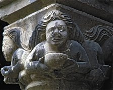 Capital of one of the Gothic galleries of the cloister built between 1387-1401. Female figure wit…