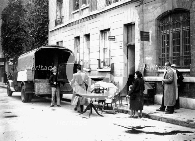 Delivery of furniture confiscated from Jews to victims of RAF bombing, Paris, April 1942. Artist: Unknown