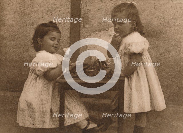 'Two young girls by a table', 1937.  Artist: Unknown.