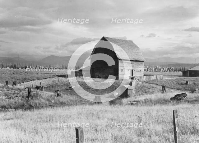 Type barn, characteristic of Idaho, on farm of older settler, Boundary County, Idaho, 1939. Creator: Dorothea Lange.