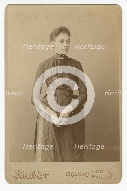Cabinet card of a woman, 1885-1892. Creator: William J. Kuebler.