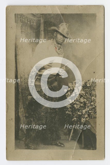 Photograph portrait of a man dressed as a cowboy, early 20th century. Creator: Unknown.